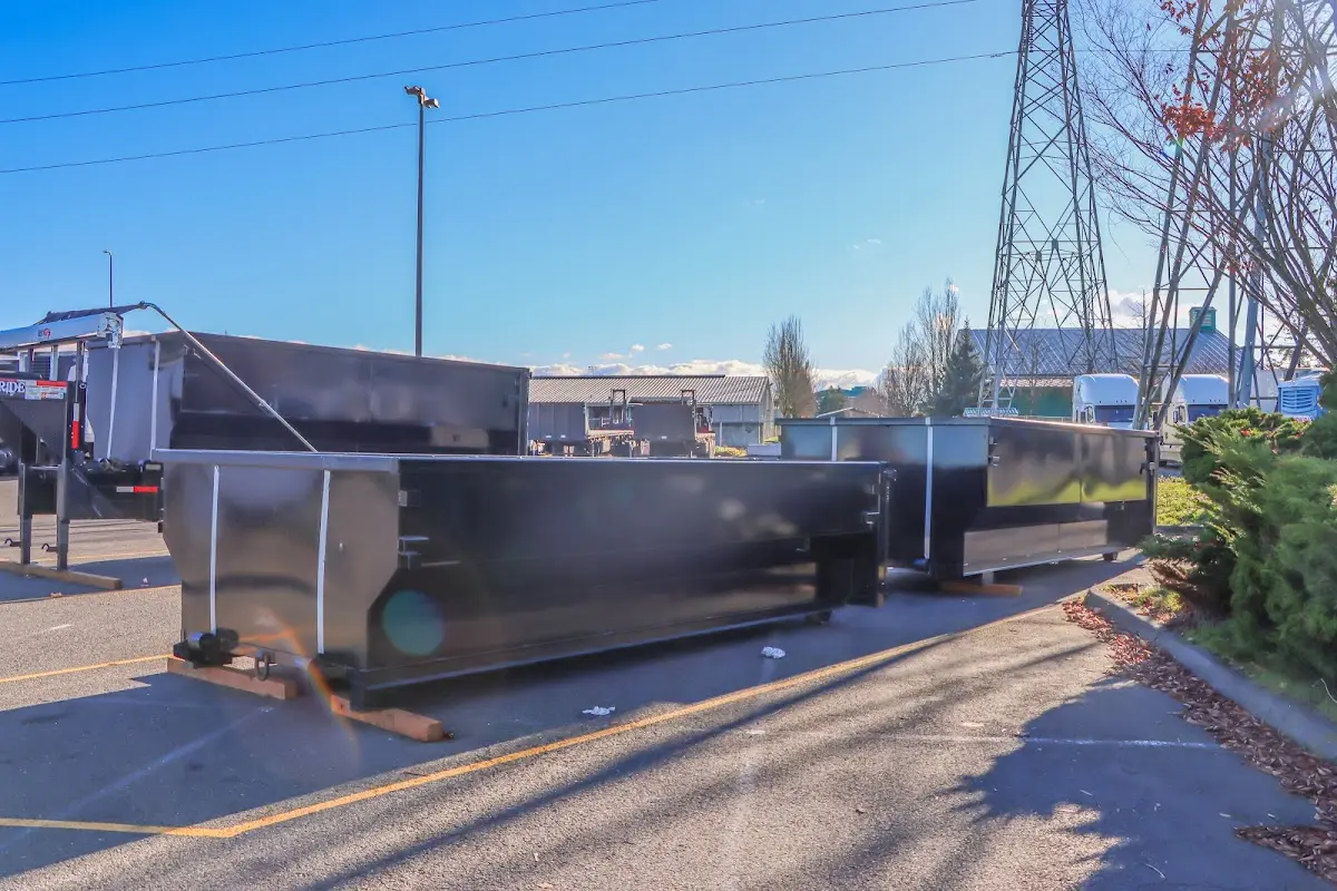 Roll-off dumpster ready for waste disposal at job site for Construction Dumpster Rental in East Manchester